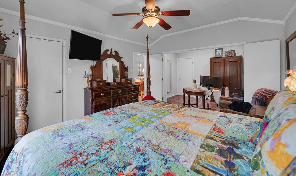 1065 Dendron Drive Hewitt, TX 76643 - Photo 16 of 32 a bedroom with a bed and a chandelier