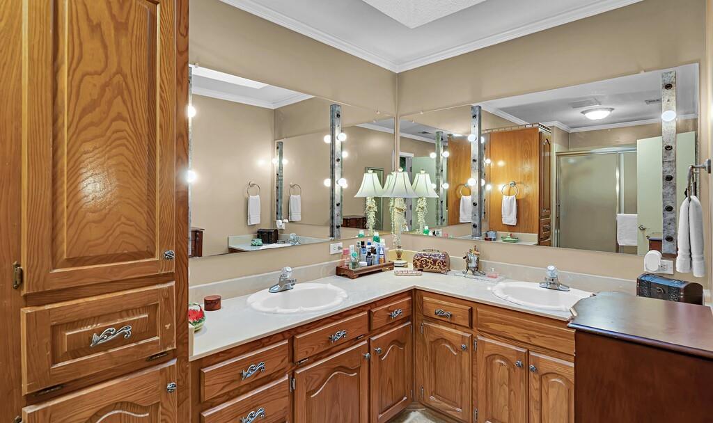 1065 Dendron Drive Hewitt, TX 76643 - Photo 17 of 32 a bathroom with a sink double vanity and a mirror