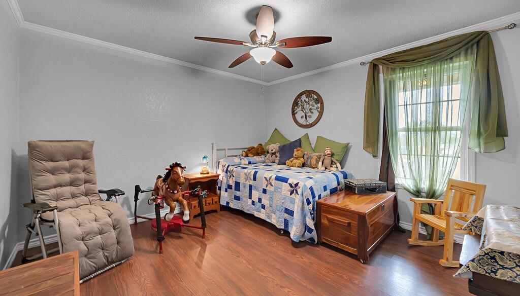 1065 Dendron Drive Hewitt, TX 76643 - Photo 19 of 32 a bedroom with furniture and a large window