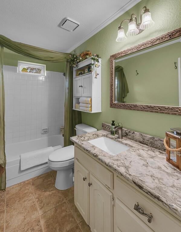 1065 Dendron Drive Hewitt, TX 76643 - Photo 20 of 32 a bathroom with a granite countertop sink mirror vanity bathtub and a toilet