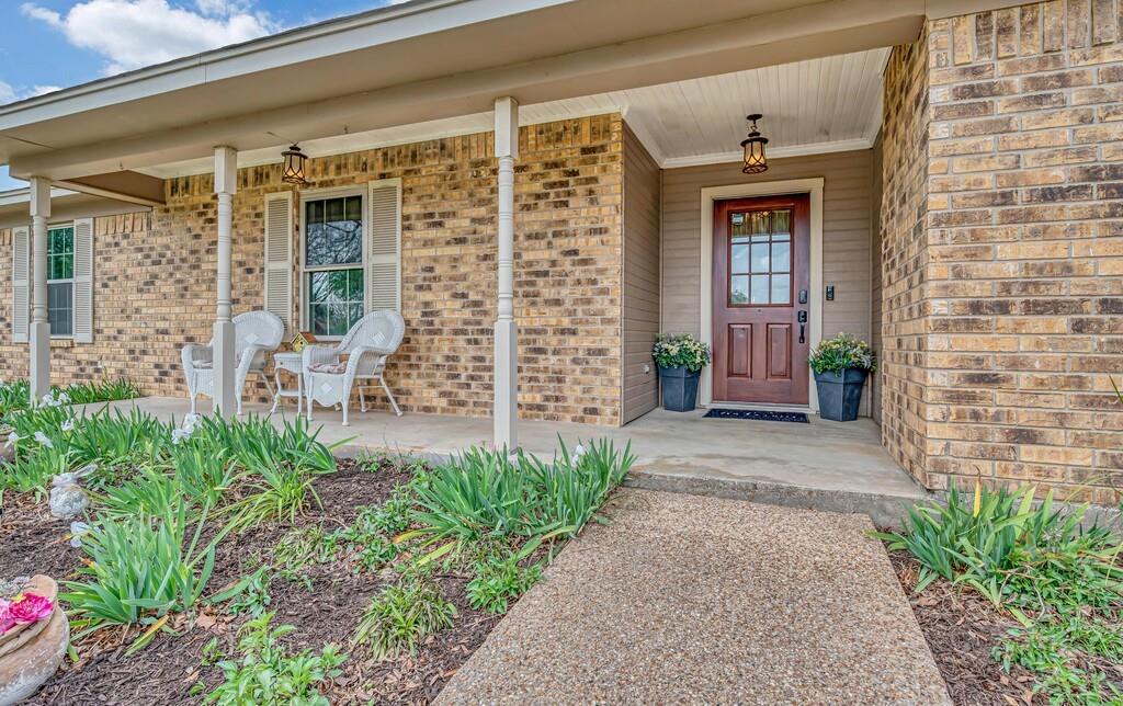 1065 Dendron Drive Hewitt, TX 76643 - Photo 2 of 32 a front view of a house with a garden