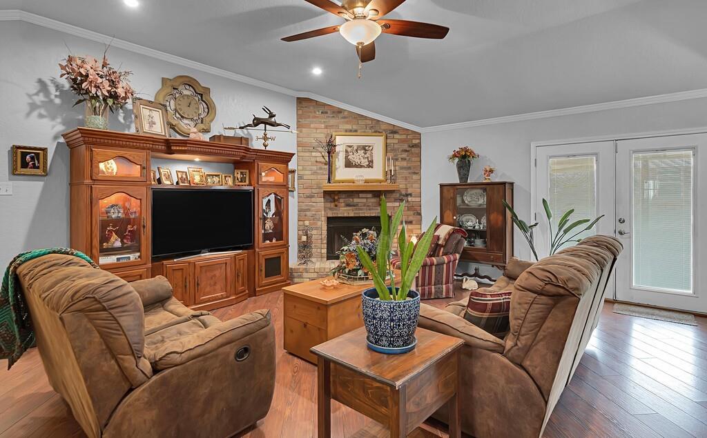 1065 Dendron Drive Hewitt, TX 76643 - Photo 4 of 32 a living room with furniture a fireplace and a flat screen tv