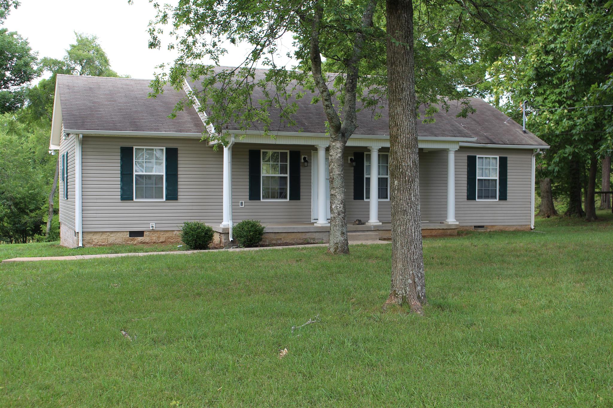 4239 Kedron Road Spring Hill, TN 37174 - Photo 1 of 5 a front view of house with yard and green space