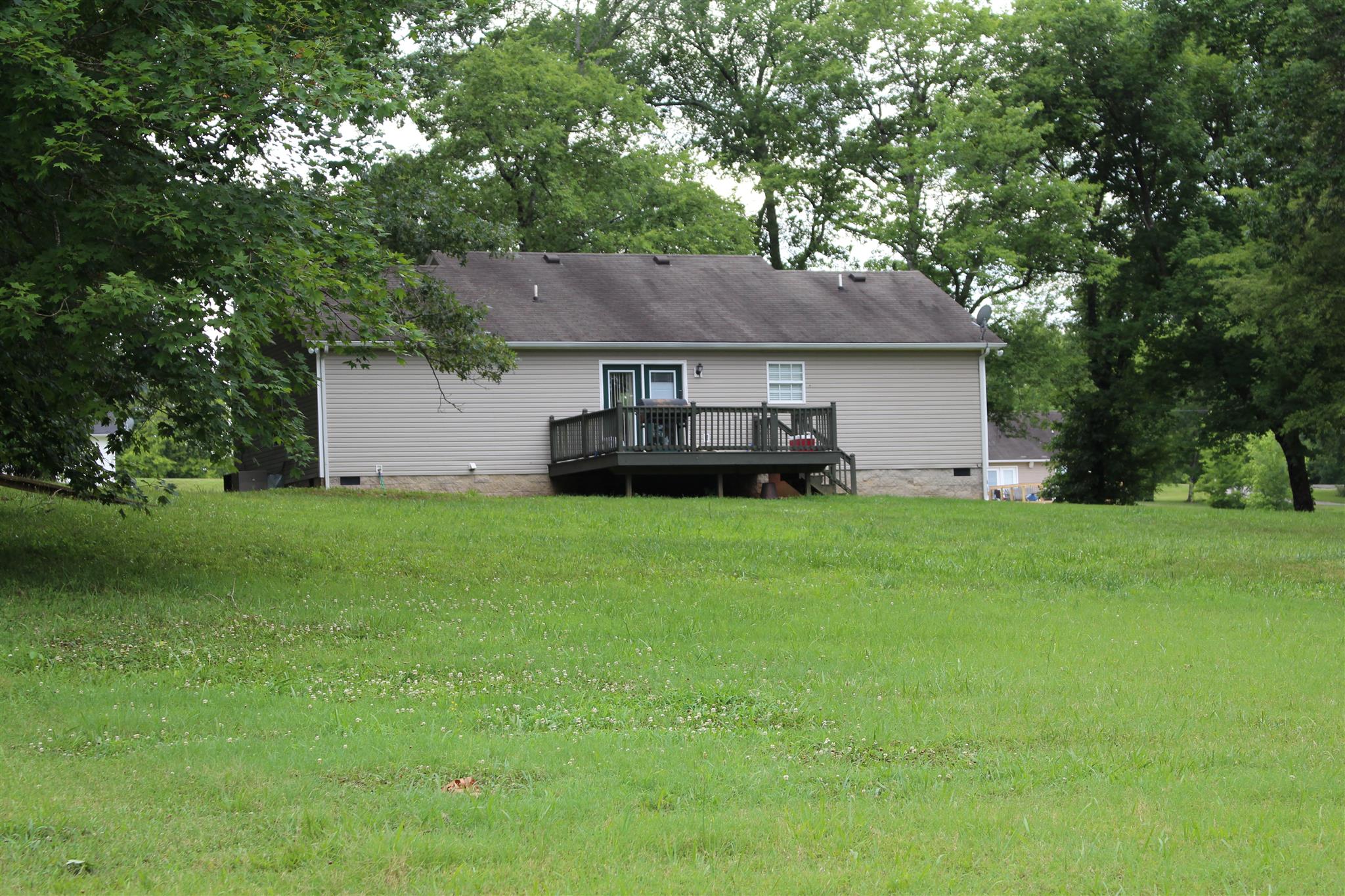 4239 Kedron Road Spring Hill, TN 37174 - Photo 3 of 5 a front view of a house with a garden and yard