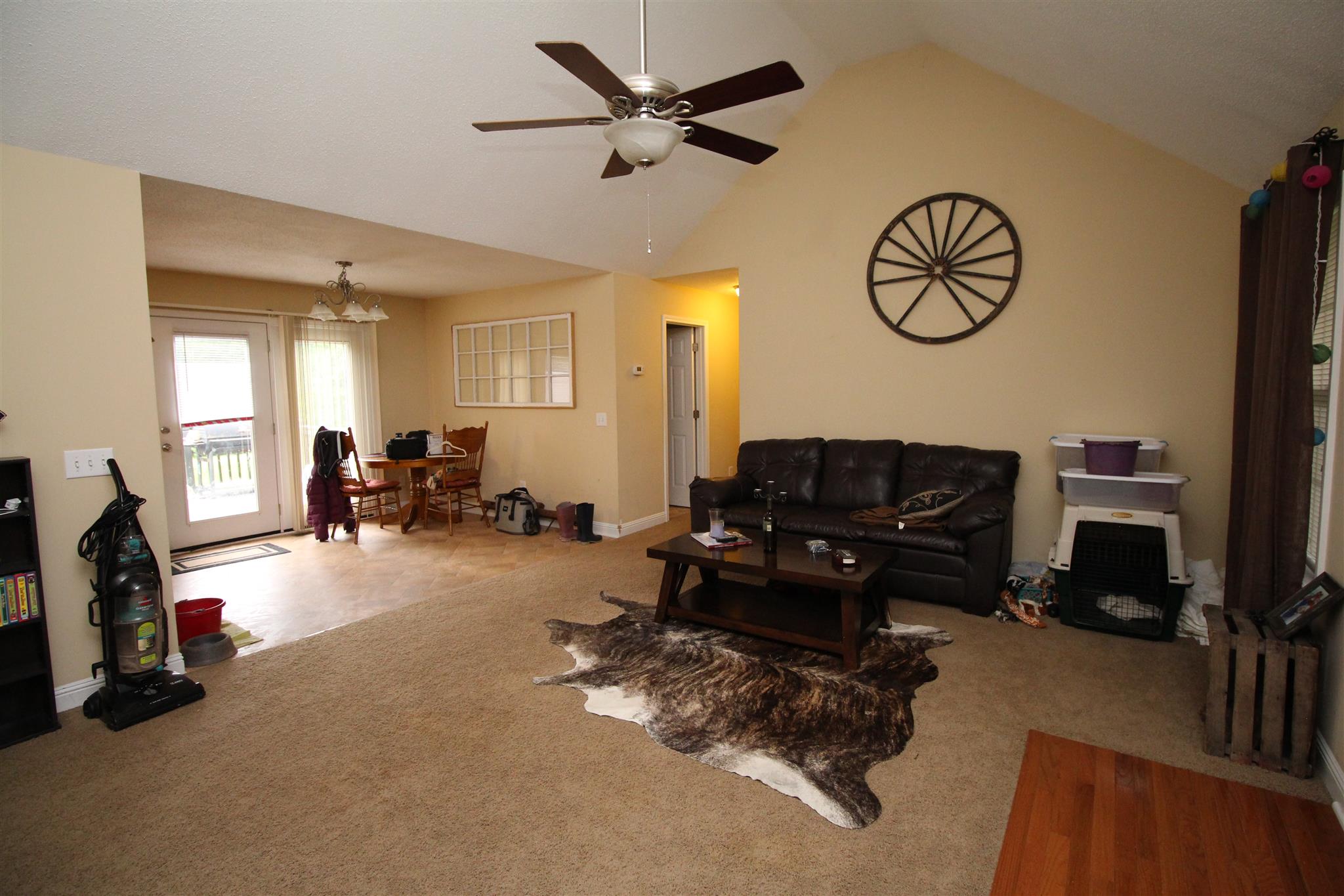 4239 Kedron Road Spring Hill, TN 37174 - Photo 5 of 5 a living room with furniture a clock tv and a window