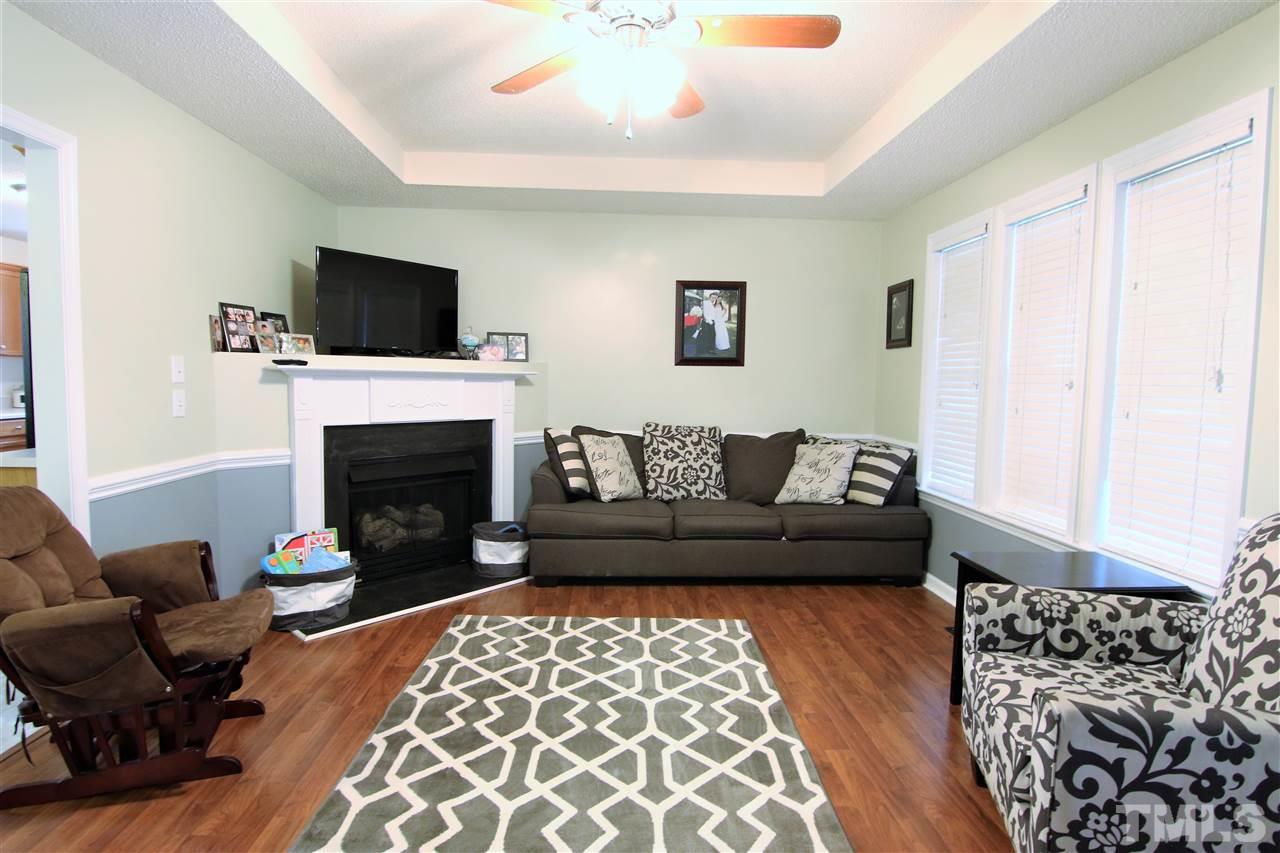 364 Rosa Circle Willow Spring, NC 27592 - Photo 4 of 21 a living room with furniture and a fireplace