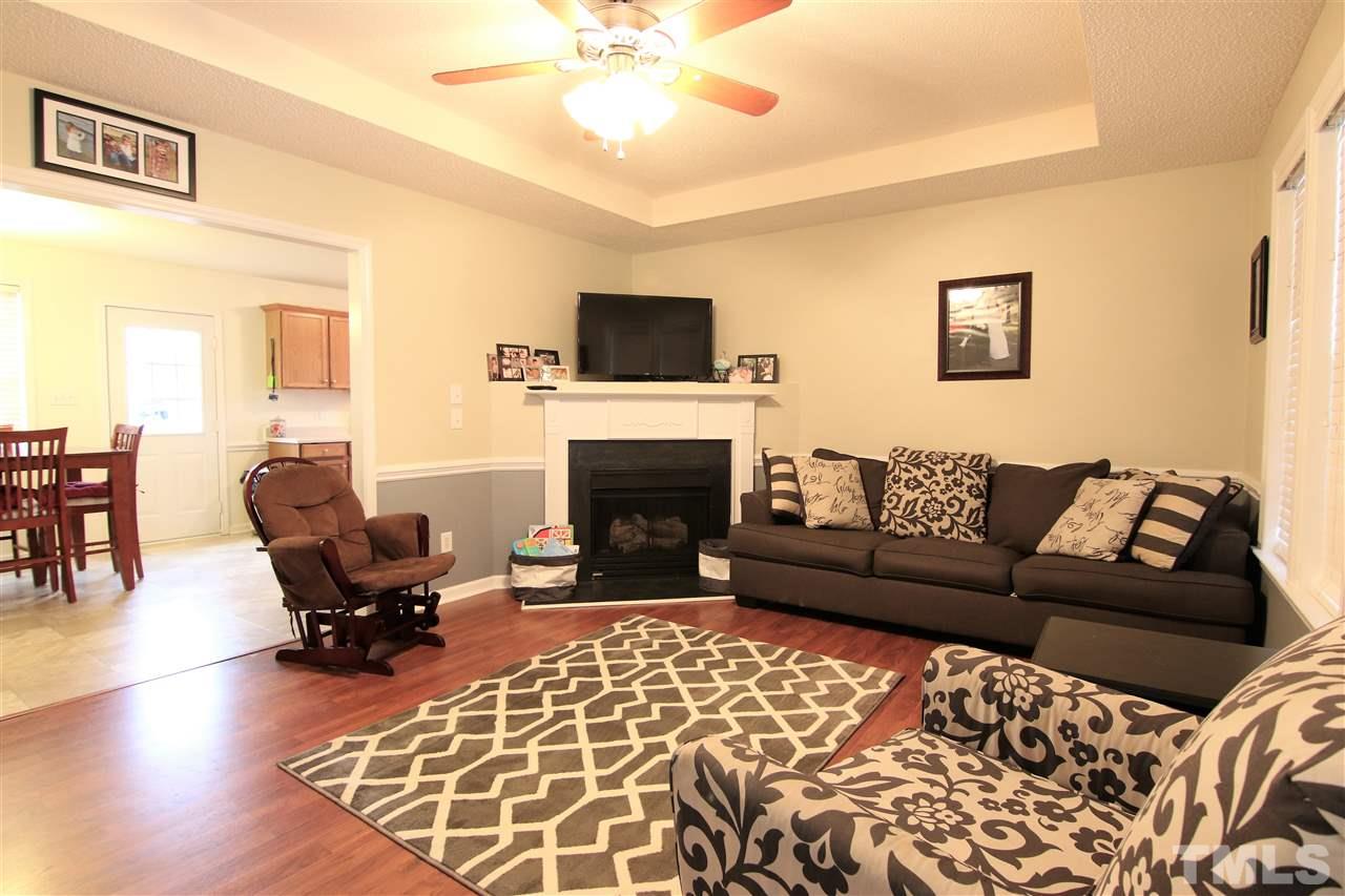 364 Rosa Circle Willow Spring, NC 27592 - Photo 5 of 21 a living room with furniture and a fireplace
