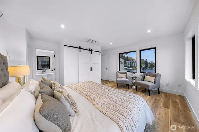 a bed room with a bed and a couch