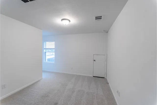 a view of a room that has a window in it