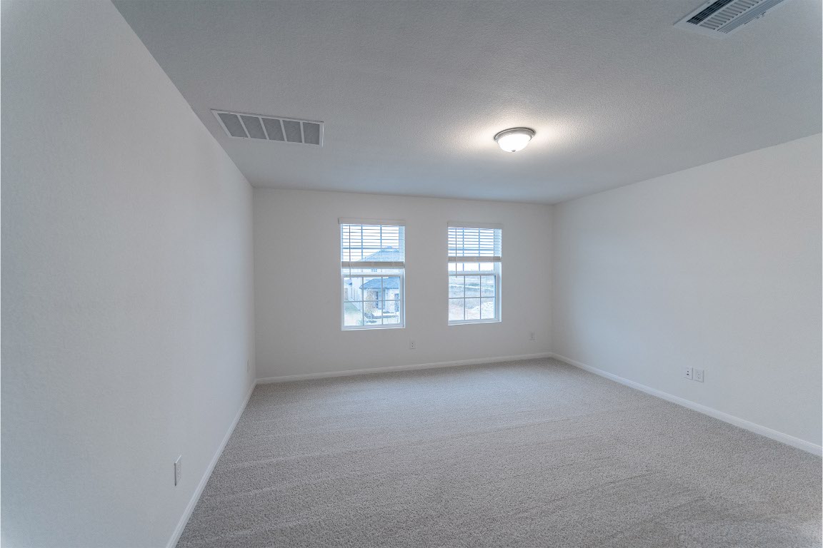 732 Barbary Coast Lane Jarrell, TX 76537 - Photo 8 of 17 a view of an empty room with a window