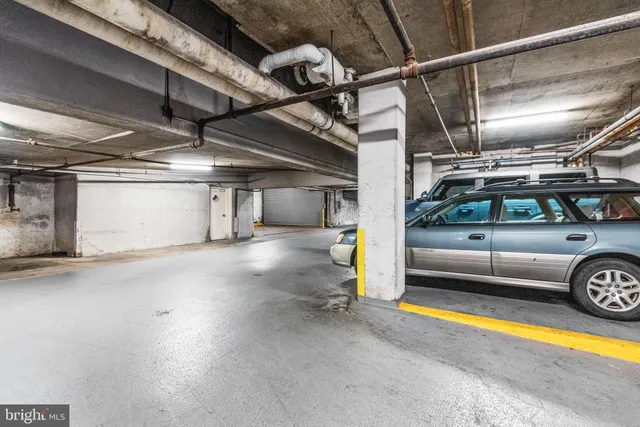 a view of parking garage with a car