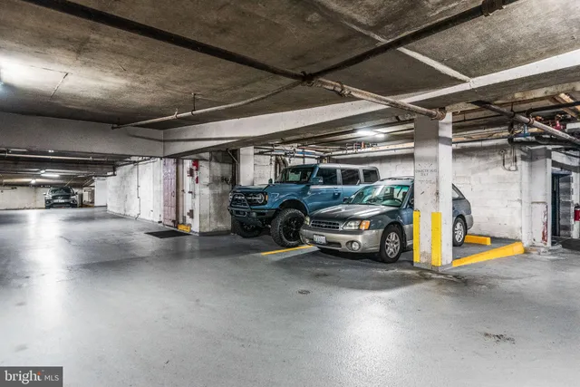 a view of parking garage with cars