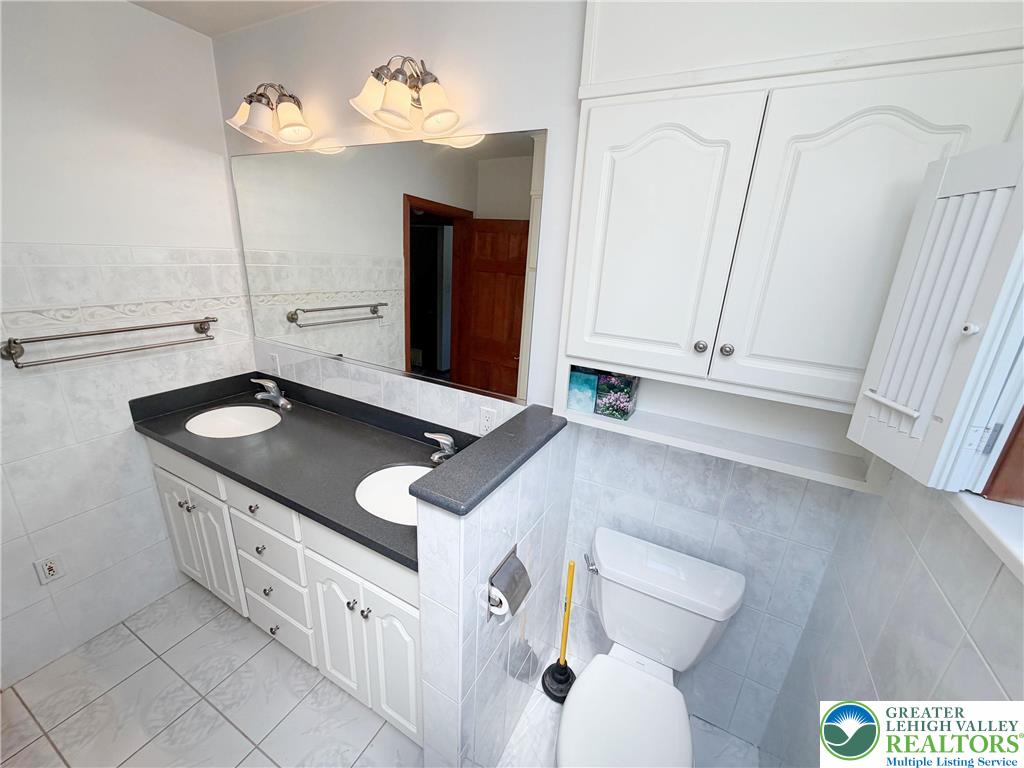 2741 Limestone Street Coplay, PA 18037 - Photo 9 of 35 a kitchen with a sink and a refrigerator