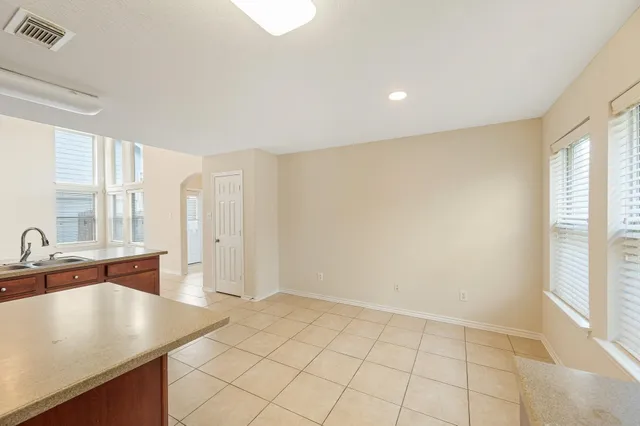 a room with a sink and a large window