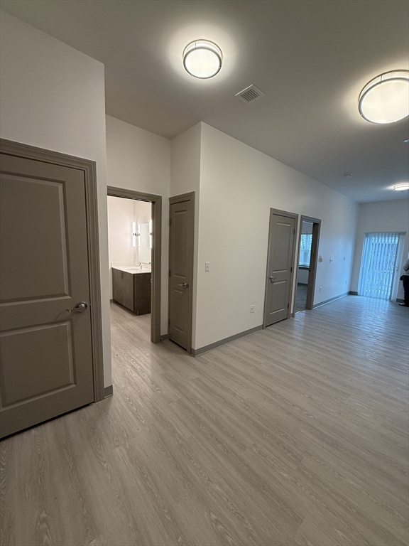 626 Main Street, Unit 103 Dennis, MA 02639 - Photo 15 of 16 wooden floor and an empty room with wooden floor