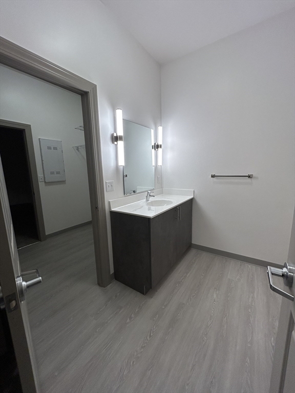 626 Main Street, Unit 103 Dennis, MA 02639 - Photo 8 of 16 a bathroom with a sink and mirror