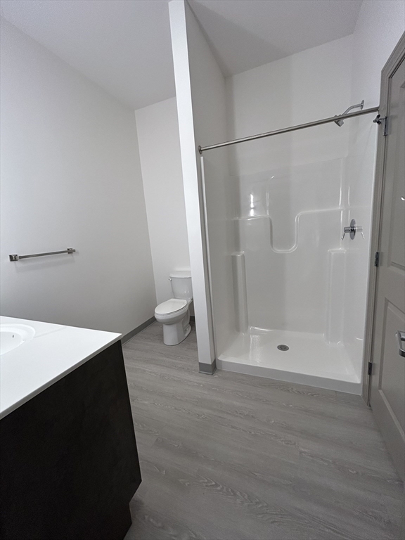 626 Main Street, Unit 103 Dennis, MA 02639 - Photo 9 of 16 a bathroom with a shower and a toilet