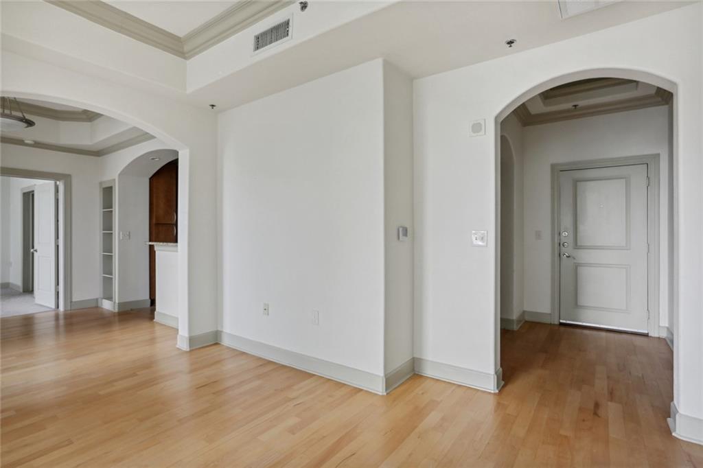 3445 Stratford Road Northeast, Unit 907 Atlanta, GA 30326 - Photo 1 of 1 a view of a hallway with wooden floor