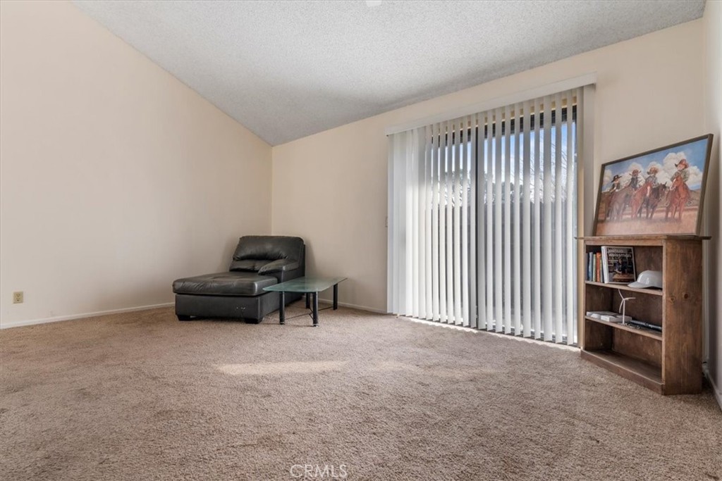 2 Village Lane Tehachapi, CA 93561 - Photo 11 of 32 a living room with furniture and a book shelf