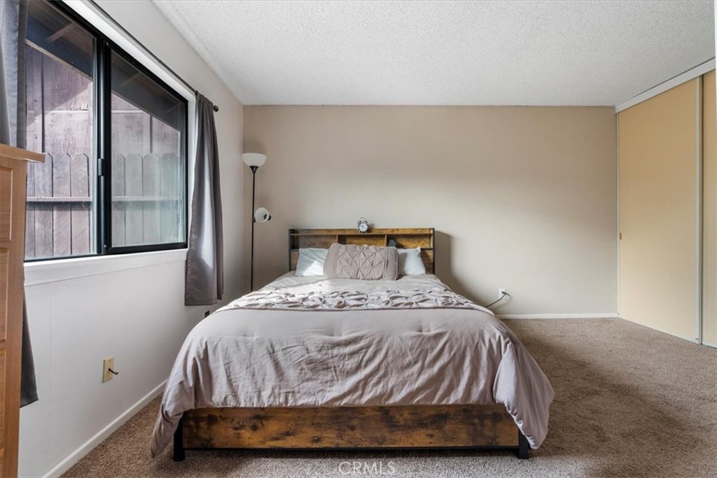 2 Village Lane Tehachapi, CA 93561 - Photo 19 of 32 a bedroom with a bed and wooden floor
