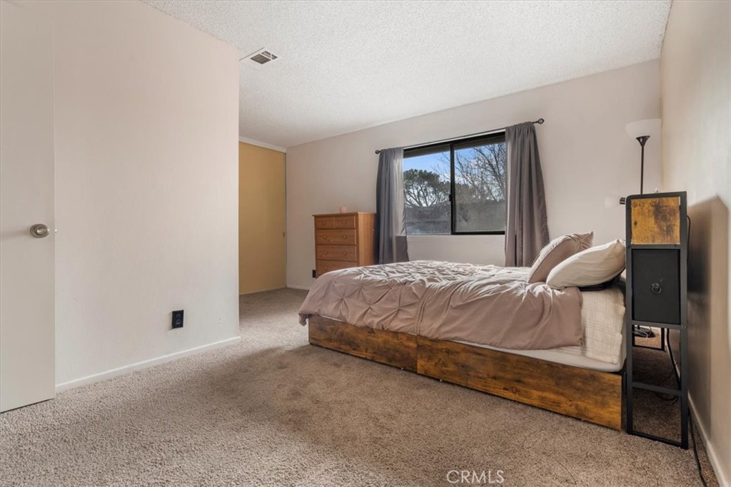 2 Village Lane Tehachapi, CA 93561 - Photo 20 of 32 a bedroom with a bed and a window