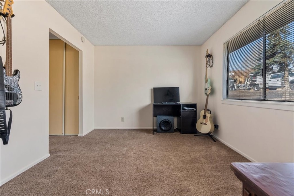 2 Village Lane Tehachapi, CA 93561 - Photo 24 of 32 a living room with furniture and a flat screen tv