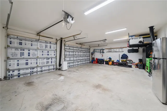 a view of parking garage with cars