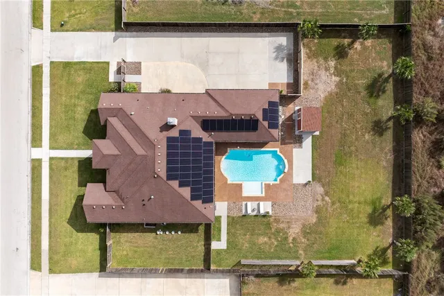 an aerial view of residential houses with outdoor space