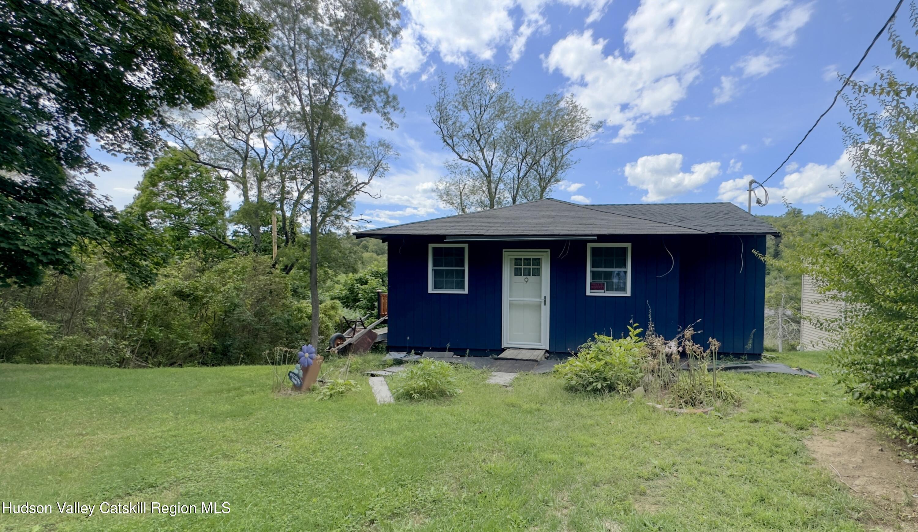 a view of a house with a yard
