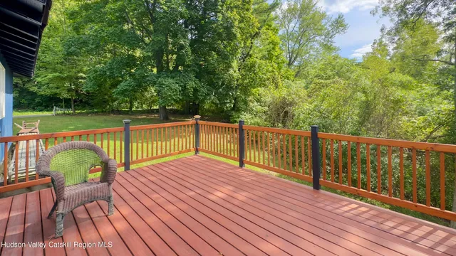 a view of deck with wooden floor and outdoor seating