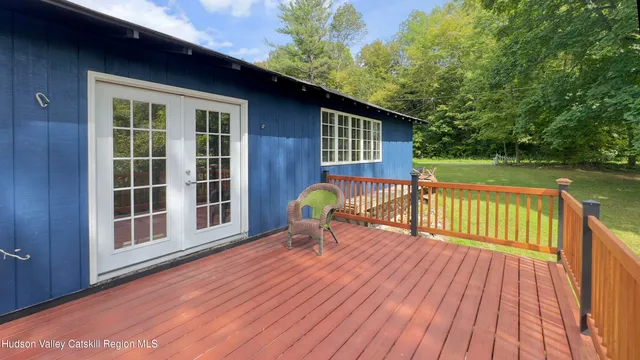 a view of a red house with a yard