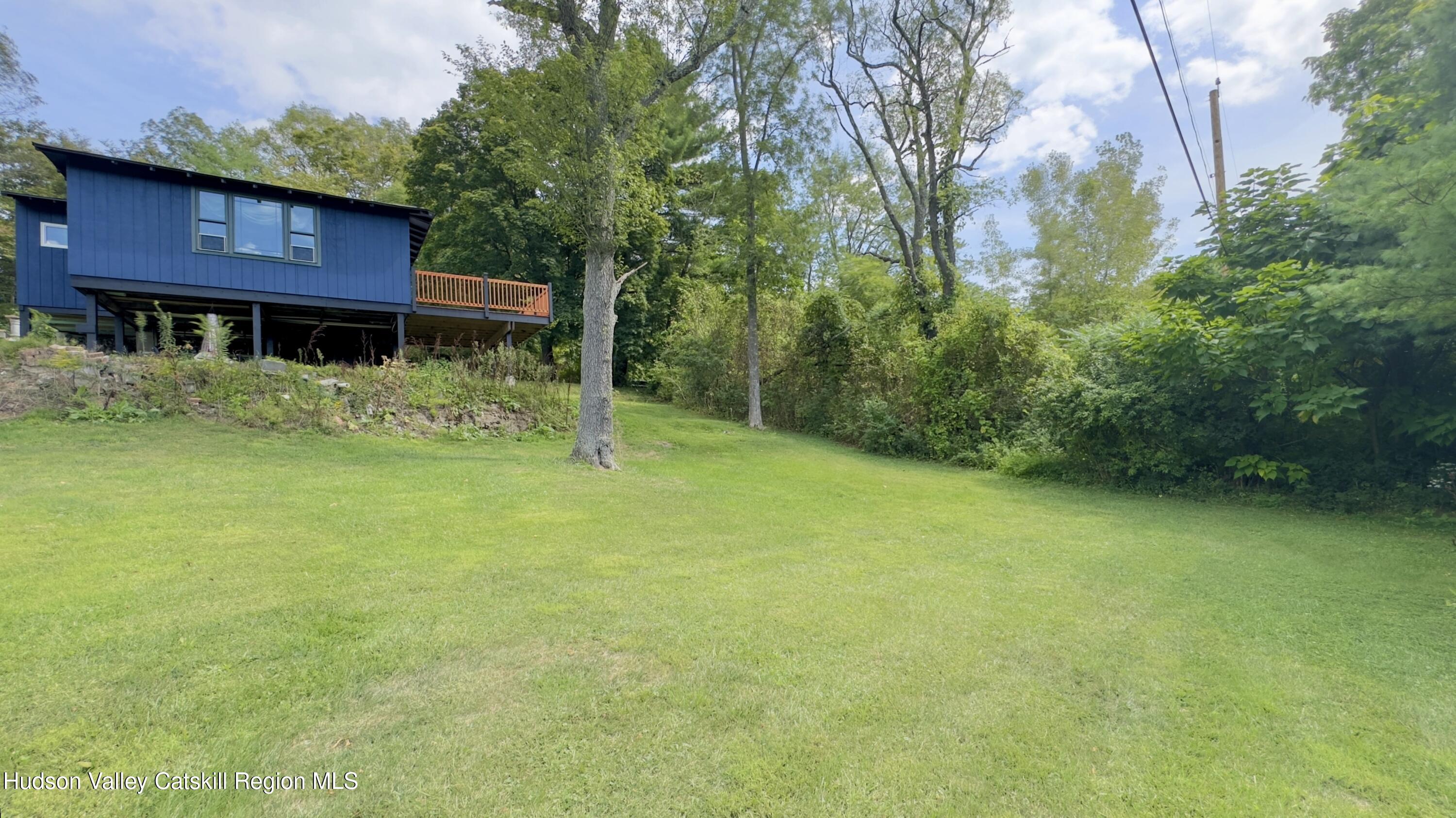 9 Old Green Lake Road Catskill, NY 12414 - Photo 10 of 12 a view of a red house with a yard