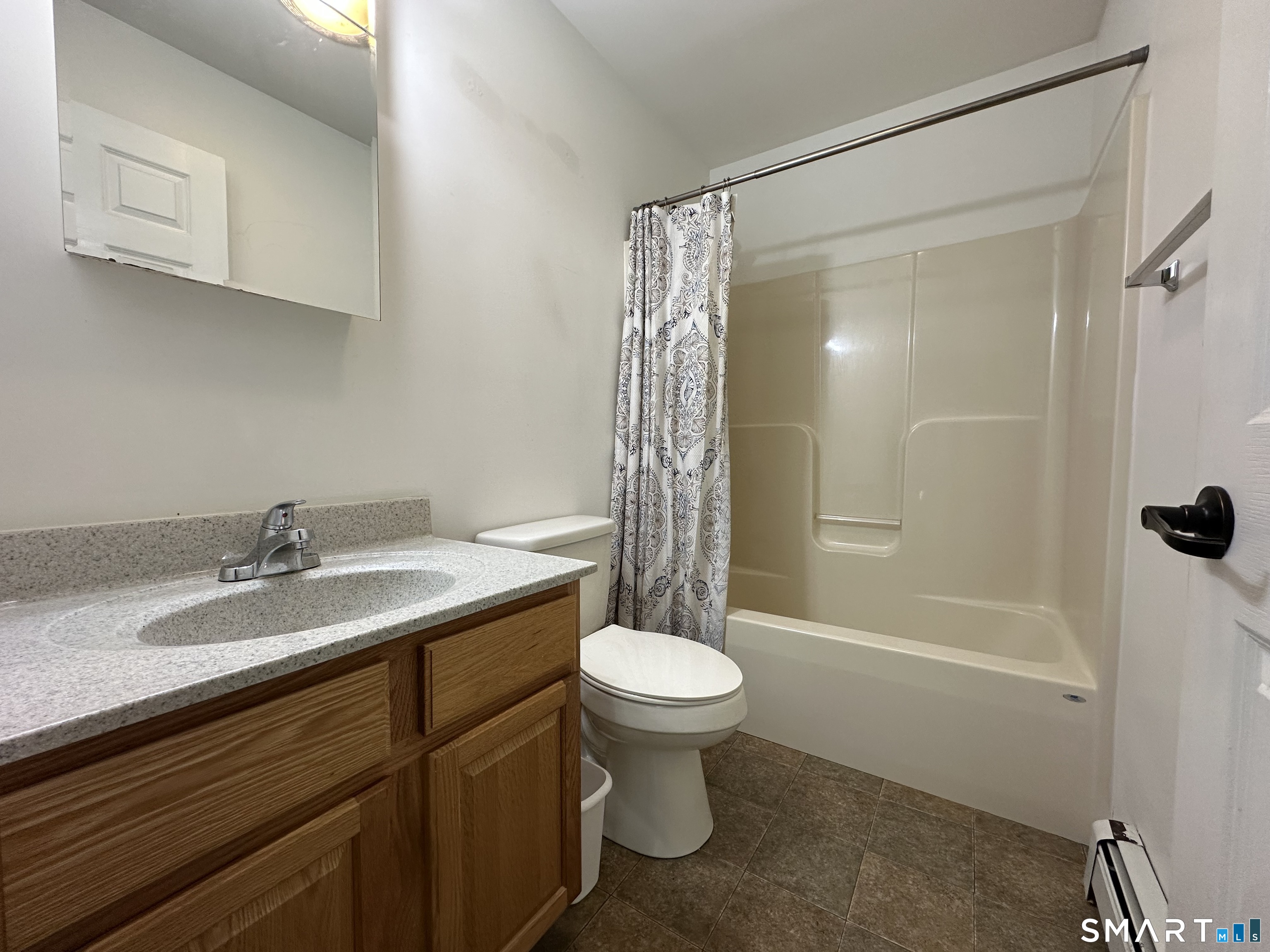 116 Tatnic Hill Road Brooklyn, CT 06234 - Photo 22 of 27 a bathroom with a sink toilet and shower