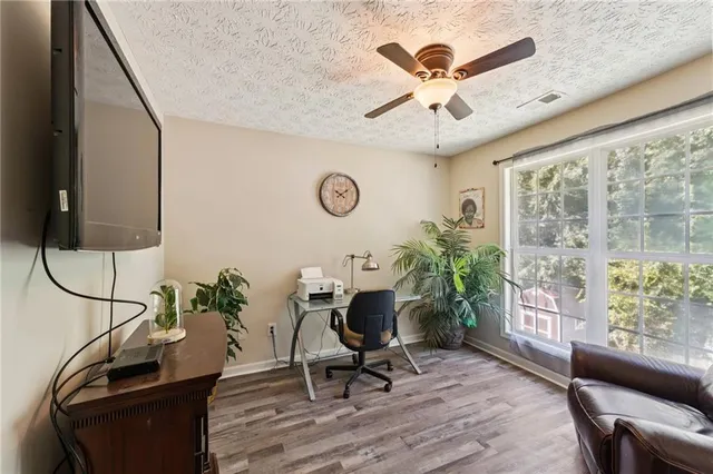 a work room with furniture and windows