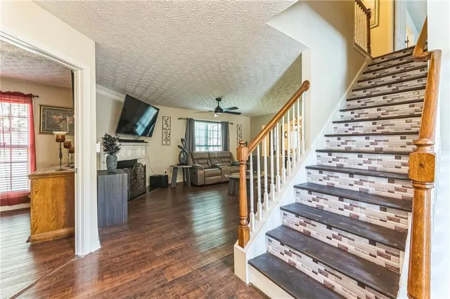 a view of entryway and hall with wooden floor