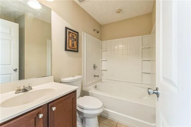 a bathroom with a sink a toilet and a bathtub