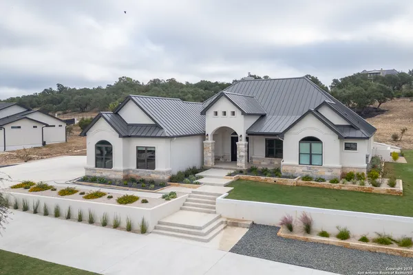 a front view of house with yard and green space