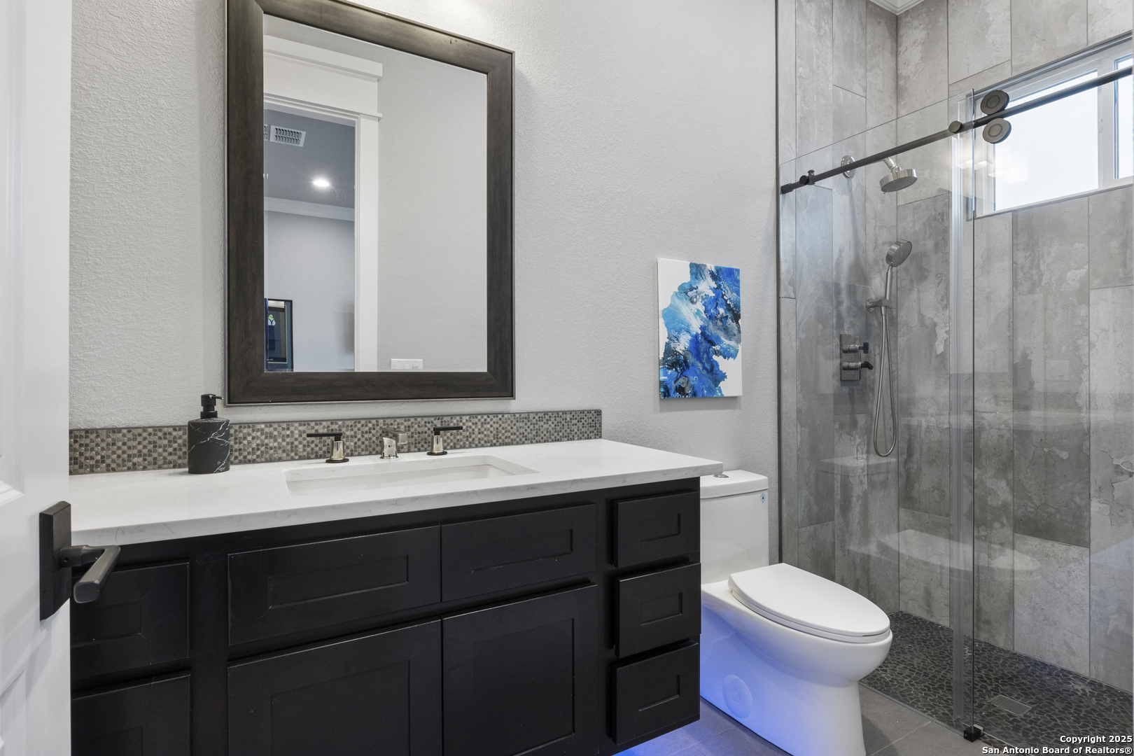 5971 Colin Ridge New Braunfels, TX 78132 - Photo 20 of 52 a bathroom with a sink and a mirror