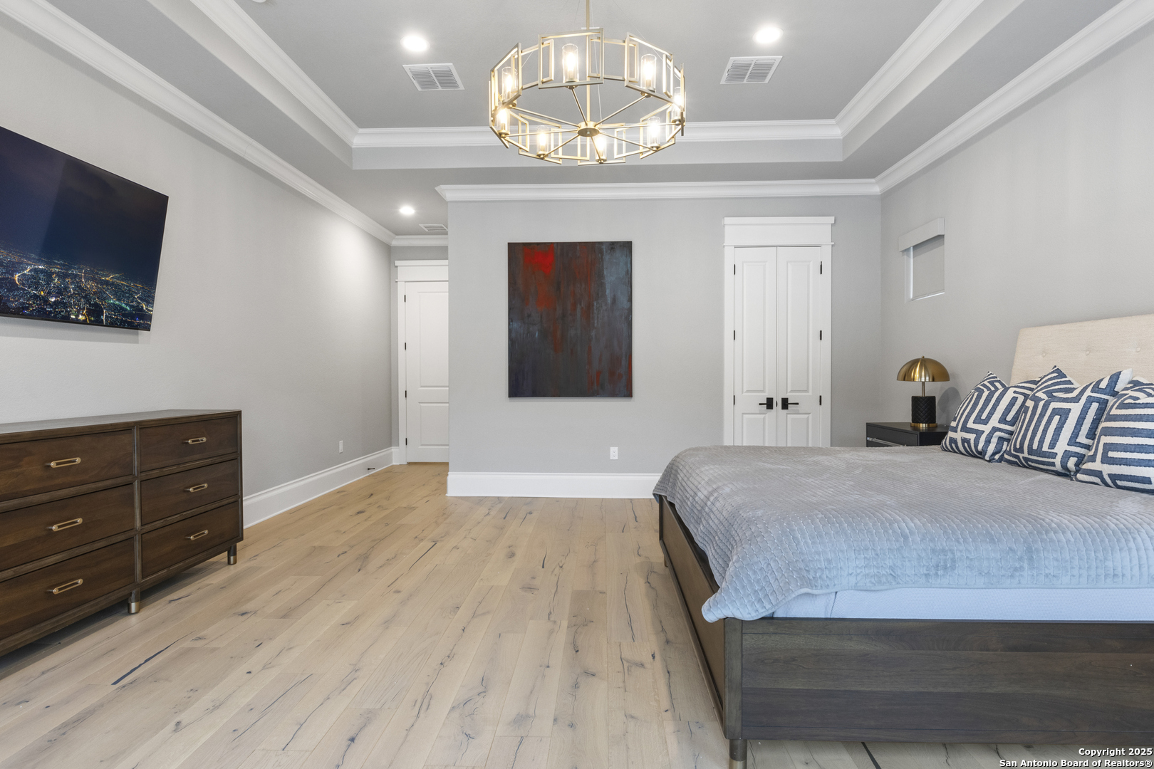 5971 Colin Ridge New Braunfels, TX 78132 - Photo 21 of 52 a bedroom with a bed and a flat screen tv