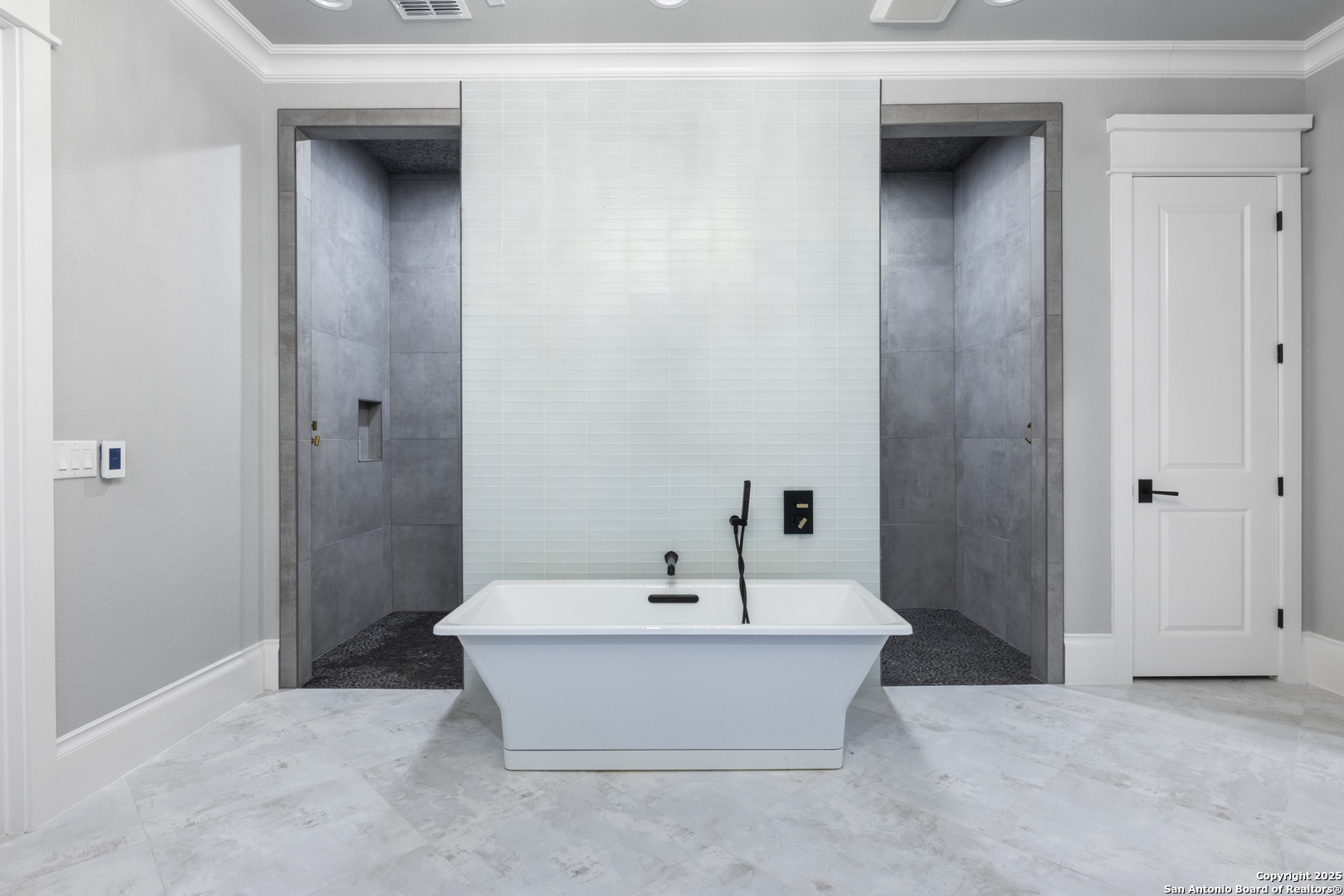 5971 Colin Ridge New Braunfels, TX 78132 - Photo 23 of 52 a bathroom with a bathtub and sink