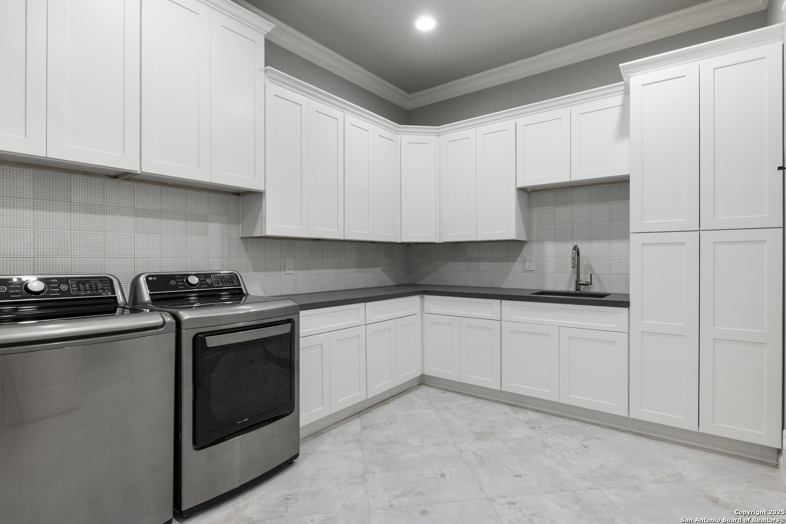 5971 Colin Ridge New Braunfels, TX 78132 - Photo 28 of 52 a kitchen with stainless steel appliances granite countertop a sink and a stove
