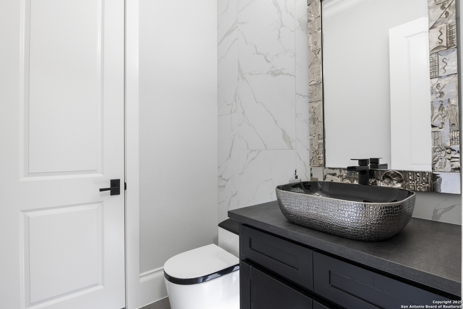 5971 Colin Ridge New Braunfels, TX 78132 - Photo 29 of 52 a bathroom with a sink a toilet and a mirror