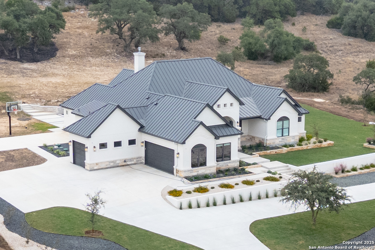 5971 Colin Ridge New Braunfels, TX 78132 - Photo 3 of 52 a house with trees in the background