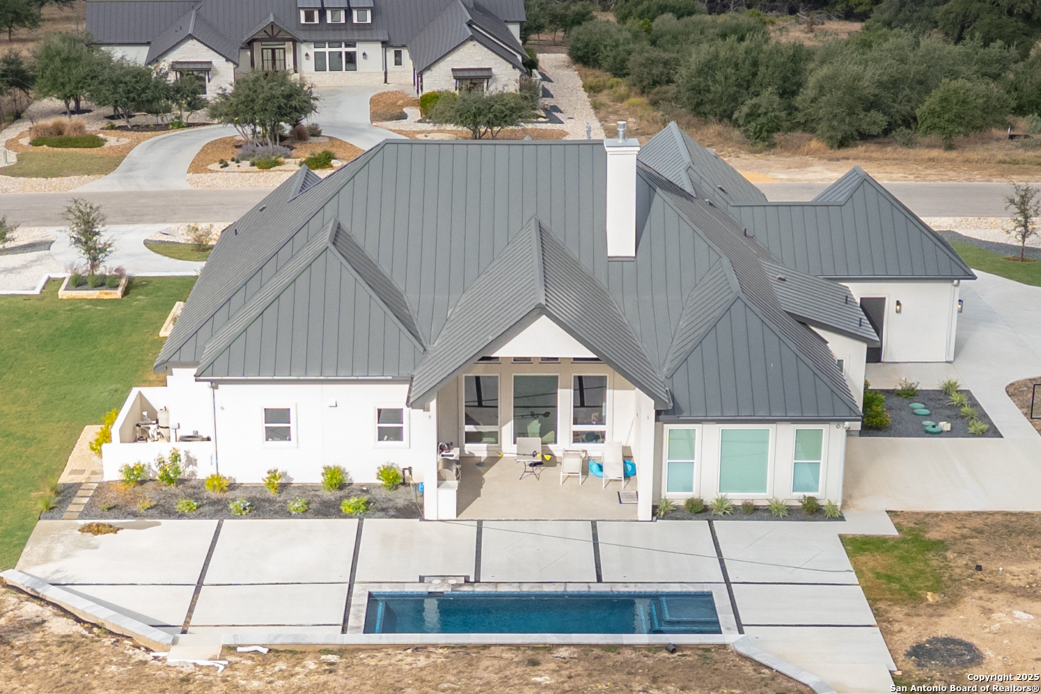 5971 Colin Ridge New Braunfels, TX 78132 - Photo 32 of 52 a front view of a house with a garden
