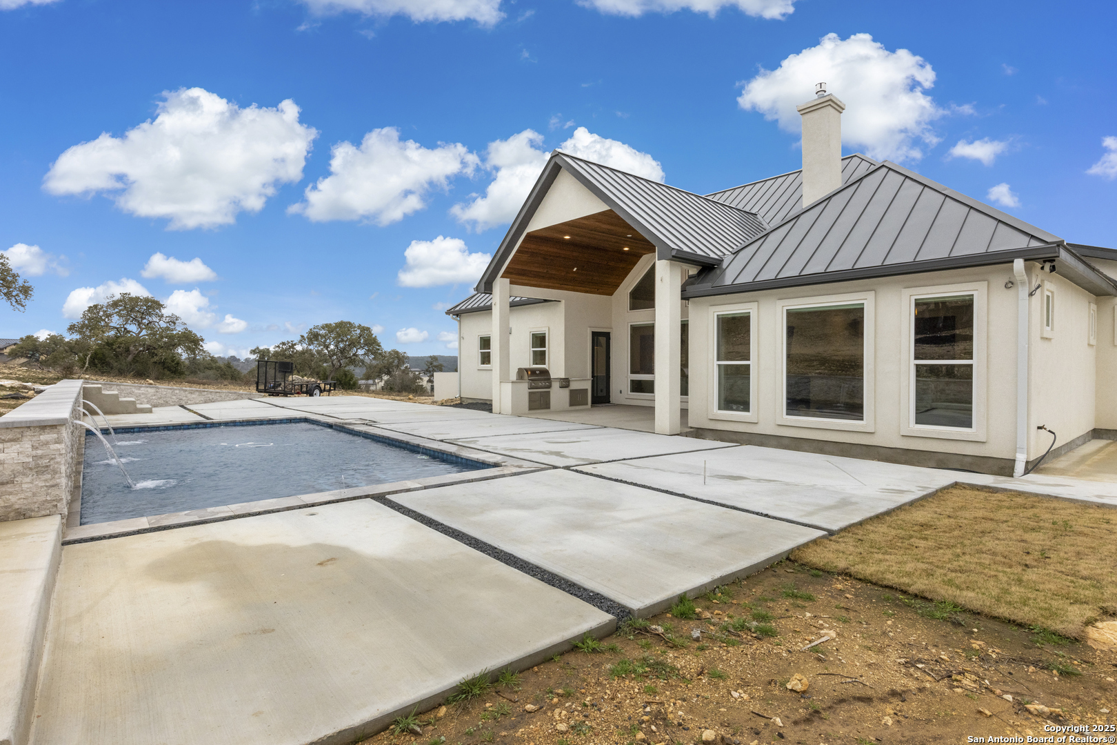 5971 Colin Ridge New Braunfels, TX 78132 - Photo 35 of 52 a view of a white house with a yard