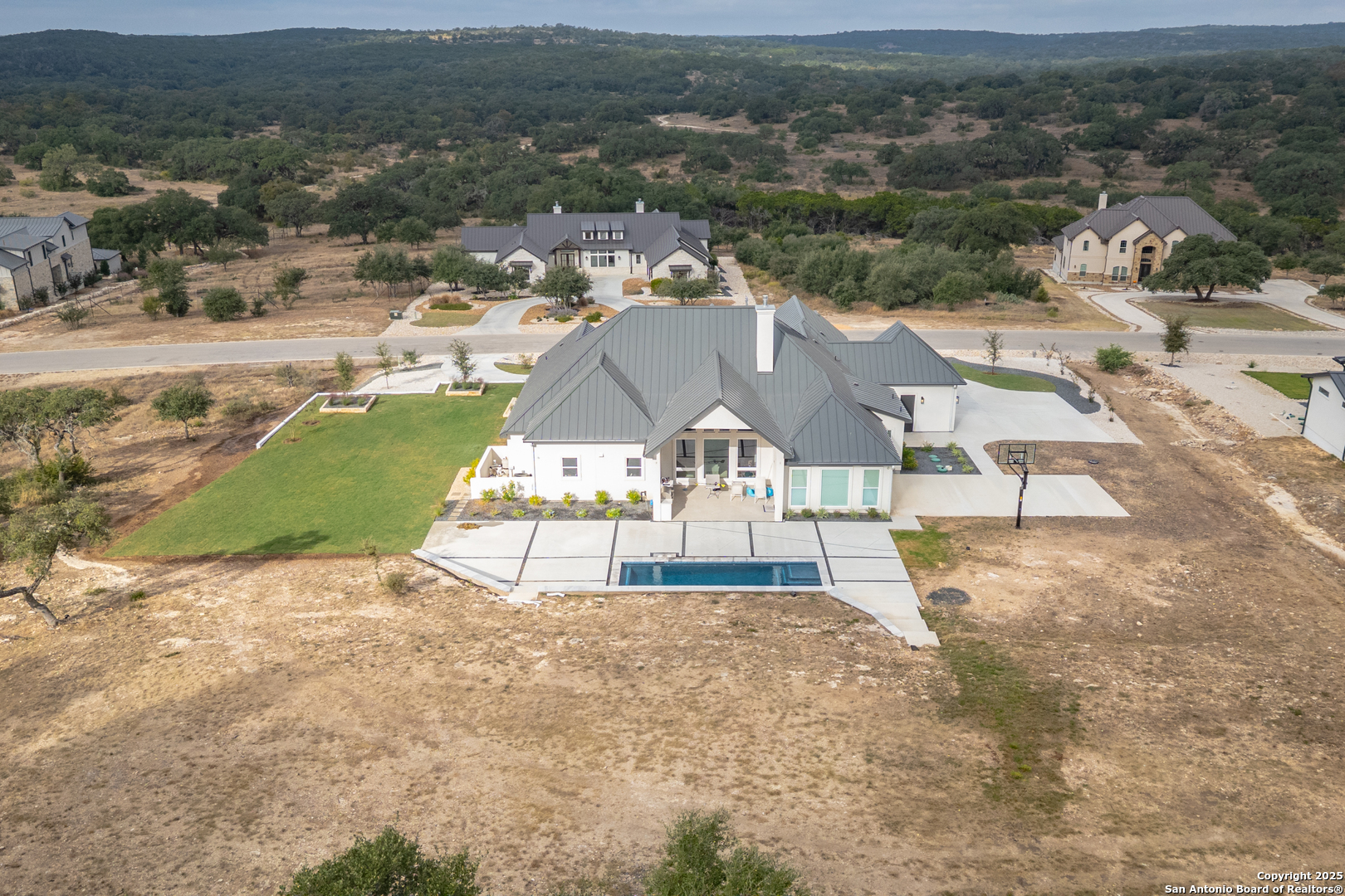 5971 Colin Ridge New Braunfels, TX 78132 - Photo 43 of 52 an aerial view of residential houses with outdoor space