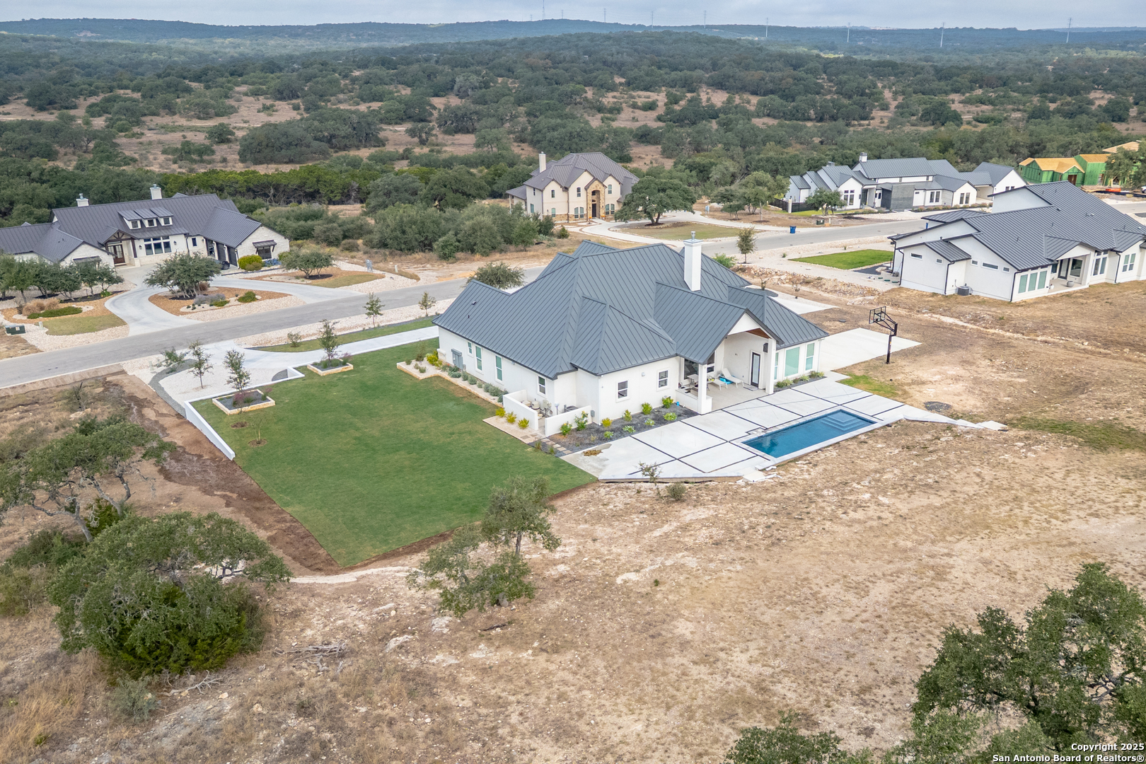 5971 Colin Ridge New Braunfels, TX 78132 - Photo 44 of 52 an aerial view of residential houses with outdoor space
