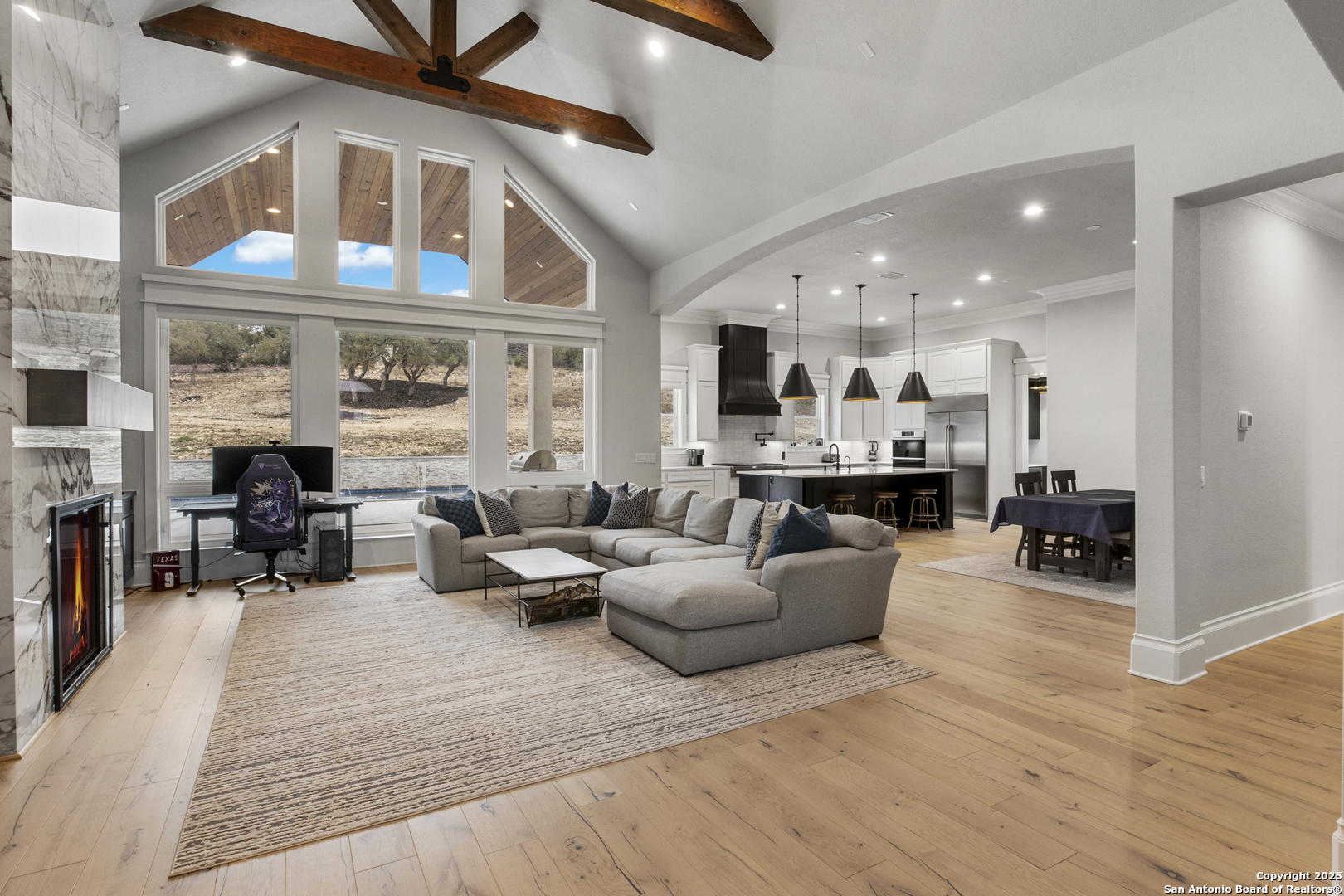 5971 Colin Ridge New Braunfels, TX 78132 - Photo 8 of 52 a living room with furniture and a fireplace