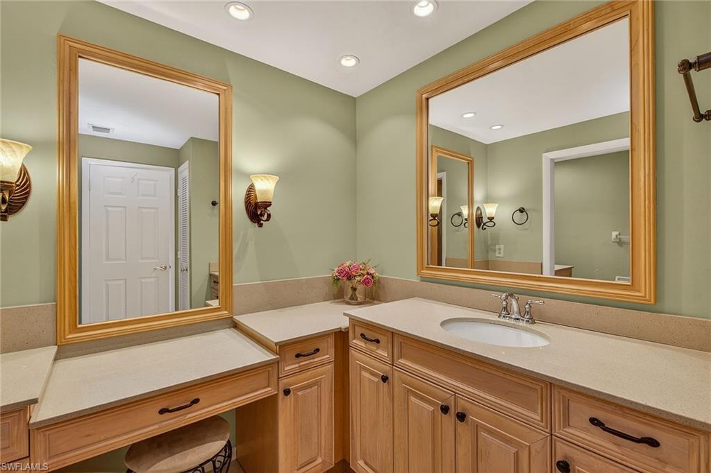 1400 Blue Point Avenue, Unit 202 Naples, FL 34102 - Photo 9 of 18 a bathroom with a sink and a mirror