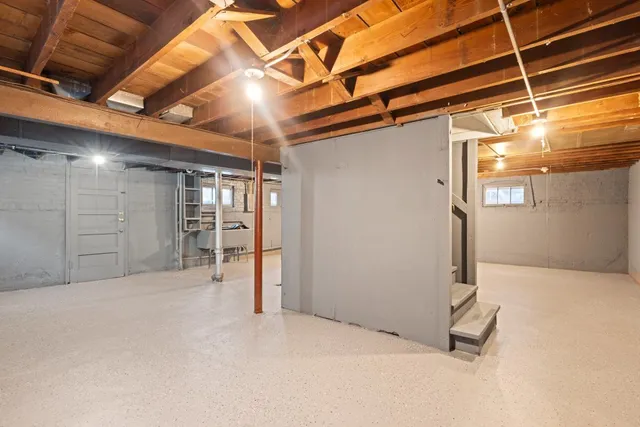 a view of empty room with wooden walls